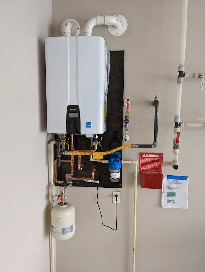 Professional plumber installing copper piping in a Upper Grand Lagoon home